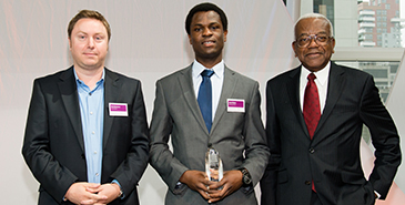 Derek Bekoe collecting his award from Sir Trevor McDonald (who hosted the awards) and Mike Blakemore from the sponsor Marks & Spencer